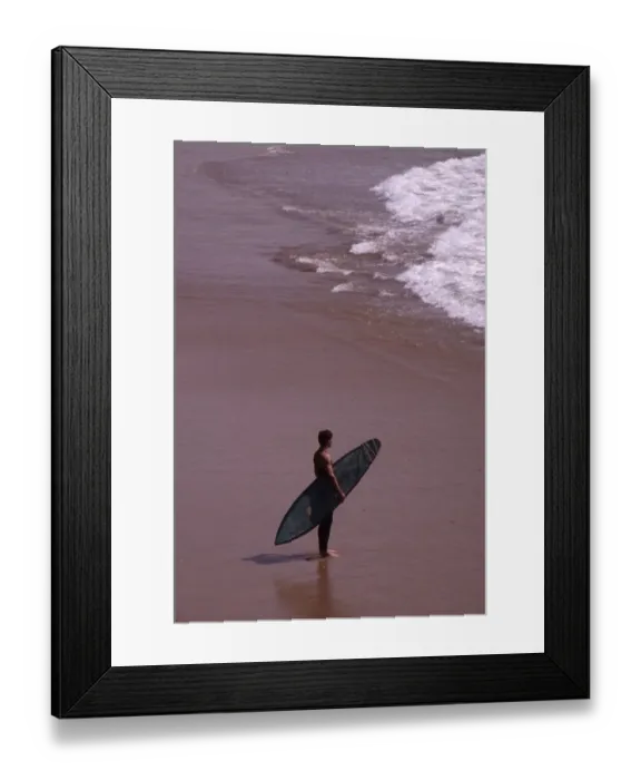 Framed Print : Surfer on the beach