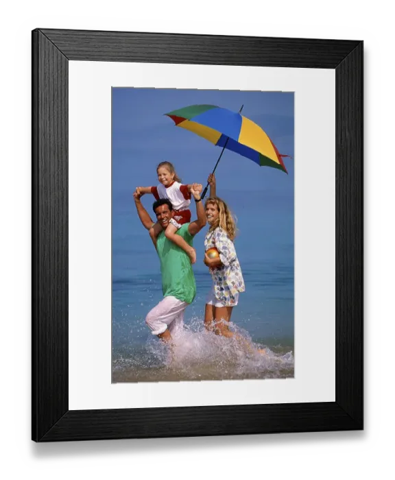Framed Print : Couple with child and parasol in the sea, beach