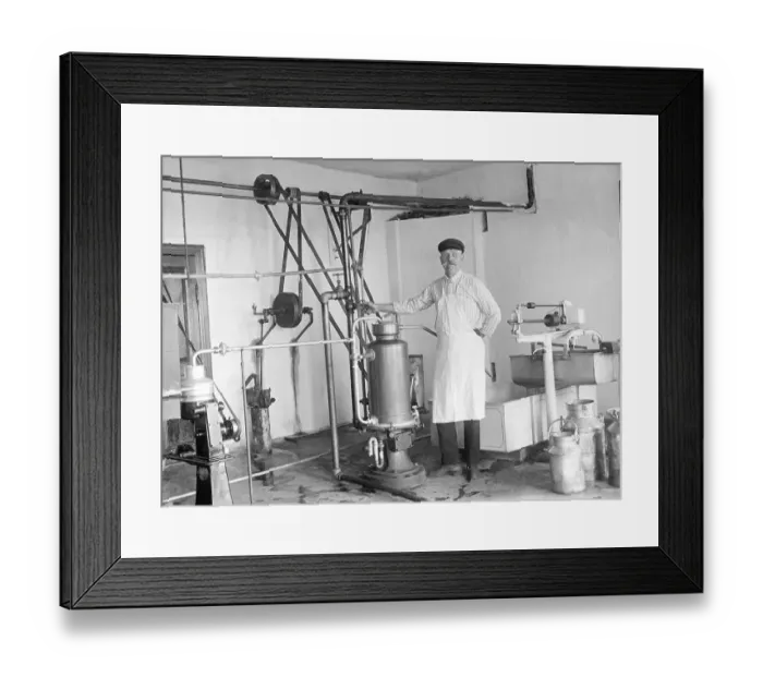Framed Print : Agriculture, dairy, man standing at a machine for the production of milk and dairy products Framed Print : Agriculture, dairy, man standing at a machine for the production of milk and dairy products