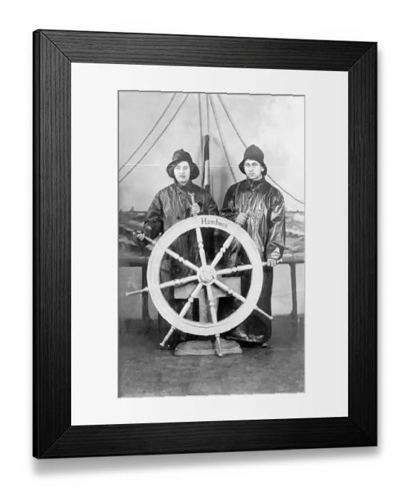 Framed Print : Woman and man play sailors on the steering wheel Framed Print : Woman and man play sailors on the steering wheel