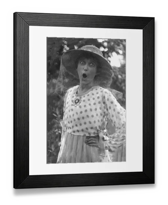 Framed Print : Outraged woman with mosquito net in front of her face Framed Print : Outraged woman with mosquito net in front of her face