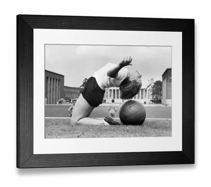 Framed Print : Woman with medicine ball, 1930s Framed Print : Woman with medicine ball, 1930s