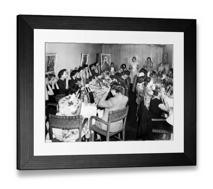 Framed Print : Women learn how to apply make-up