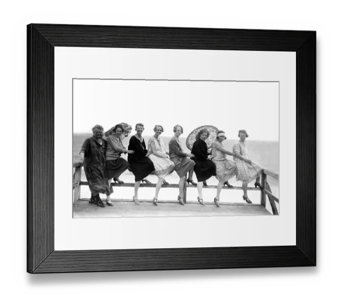 Framed Print : Eight women by the sea, two with parasols