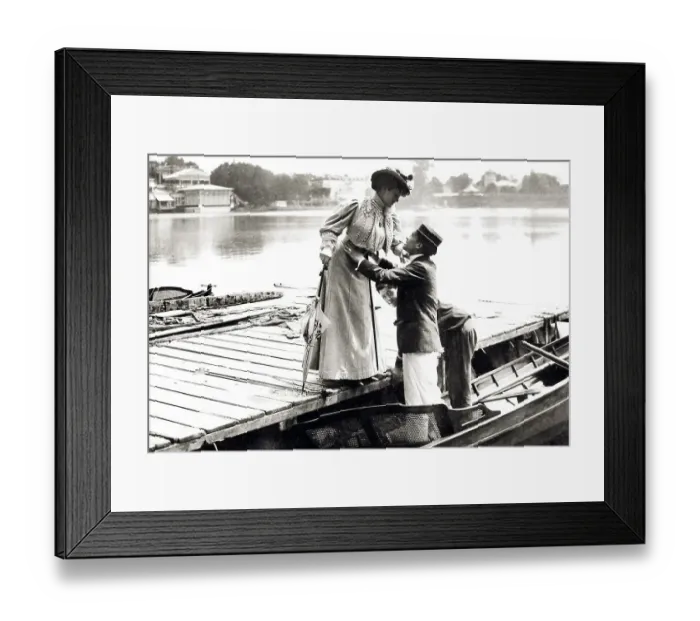 Framed Print : Couple, man helps woman into boat Framed Print : Couple, man helps woman into boat