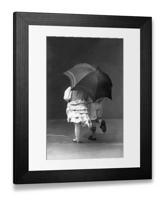 Framed Print : Couples, flirt, two children as a couple under an umbrella Framed Print : Couples, flirt, two children as a couple under an umbrella