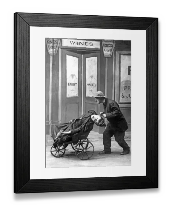 Framed Print : Couple, husband brings his drunken woman home in a cart