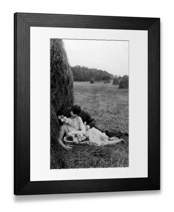 Framed Print : Couple, lovers on the harvested field in straw