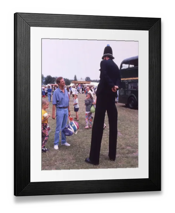 Framed Print : Large policeman speaks to man, England Framed Print : Large policeman speaks to man, England