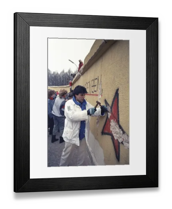 Framed Print : People climbing the Berlin Wall at Brandenburg Gate