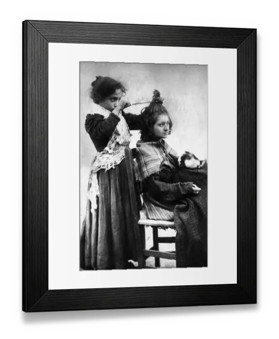 Framed Print : Girl hairdressing her girlfriend Framed Print : Girl hairdressing her girlfriend
