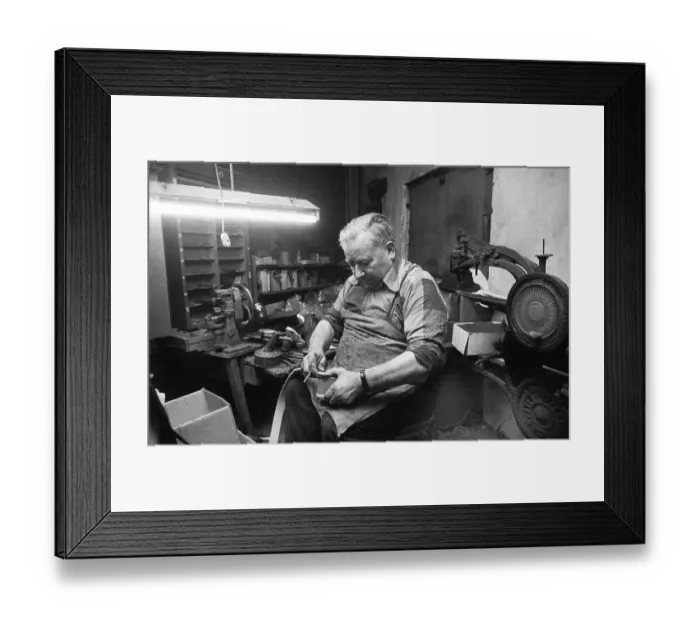 Framed Print : In the workshop of a Schumacher as a sole trader on 12
