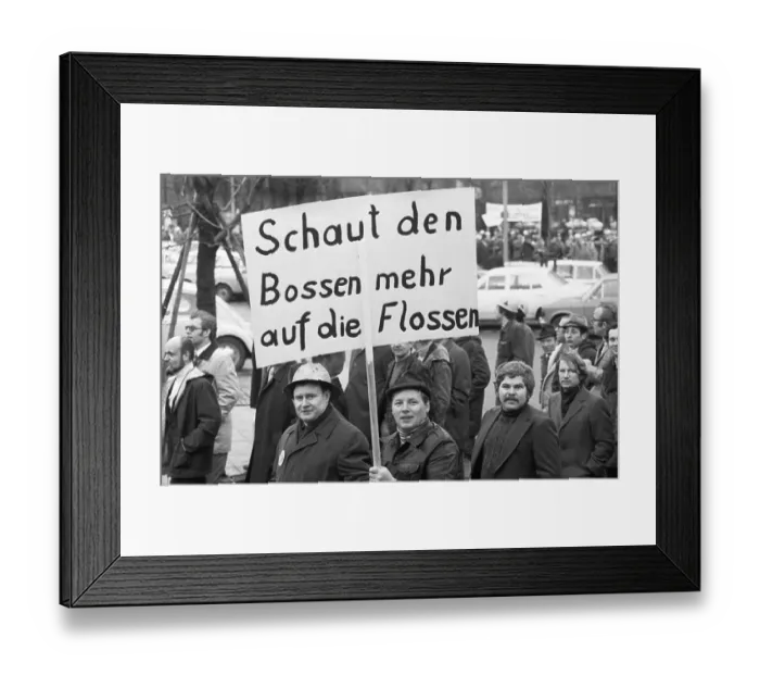 Framed Print : The concern for their jobs is written all over the faces of the workers Framed Print : The concern for their jobs is written all over the faces of the workers