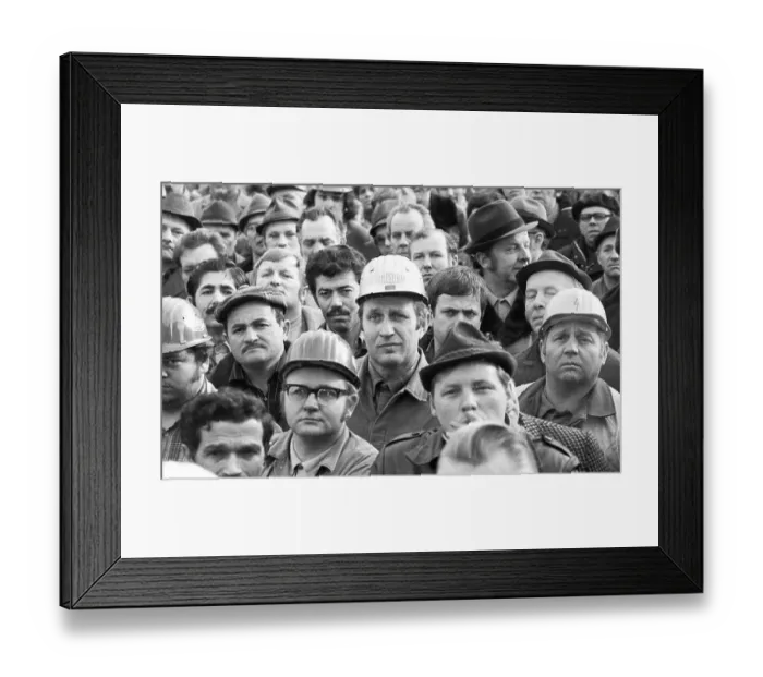 Framed Print : The concern for their jobs is written all over the faces of the workers Framed Print : The concern for their jobs is written all over the faces of the workers