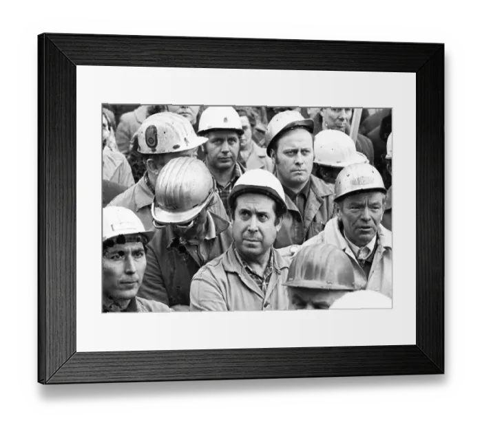 Framed Print : The concern for their jobs is written all over the faces of the workers