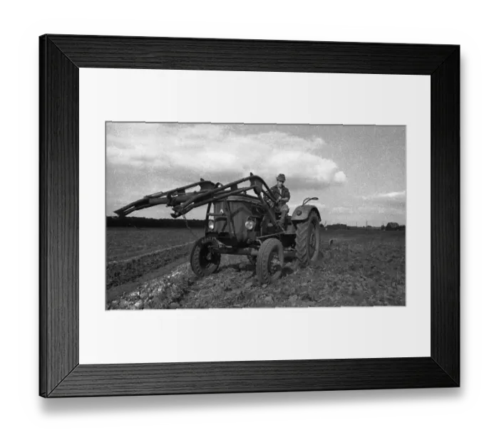 Framed Print : Farmers working in the fields in Muensterland on 10