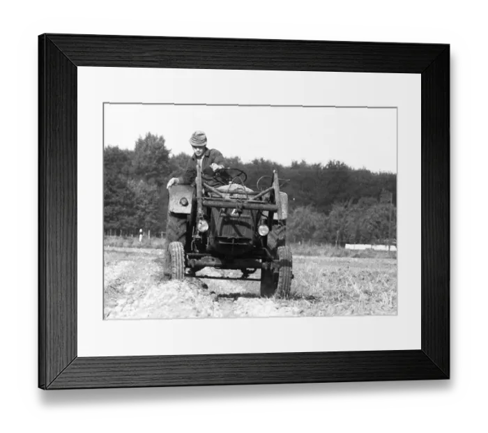 Framed Print : Farmers working in the fields in Muensterland on 10