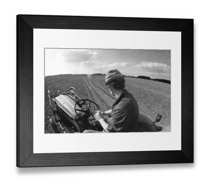 Framed Print : Farmers working in the fields in Muensterland on 10