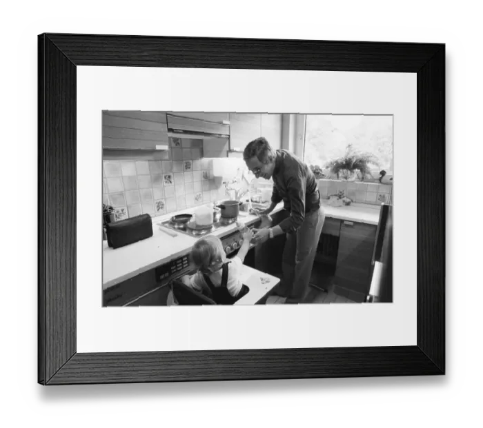 Framed Print : The care of a small child by the father was rather rare in 1980