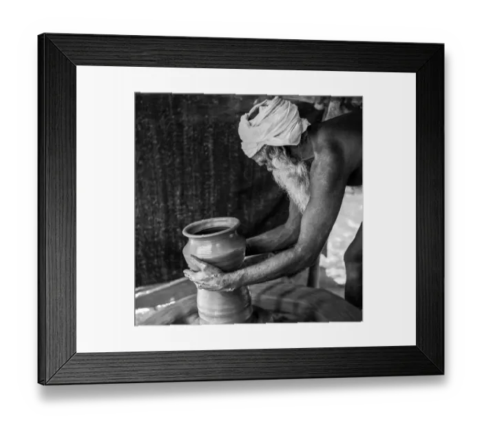 Framed Print : South Asian Indian old man making a pot by hand