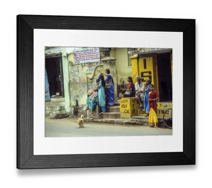 Framed Print : A mother combing her daughter's hair while waiting in the bus stop at Courtalam Kutralam Kuttalam