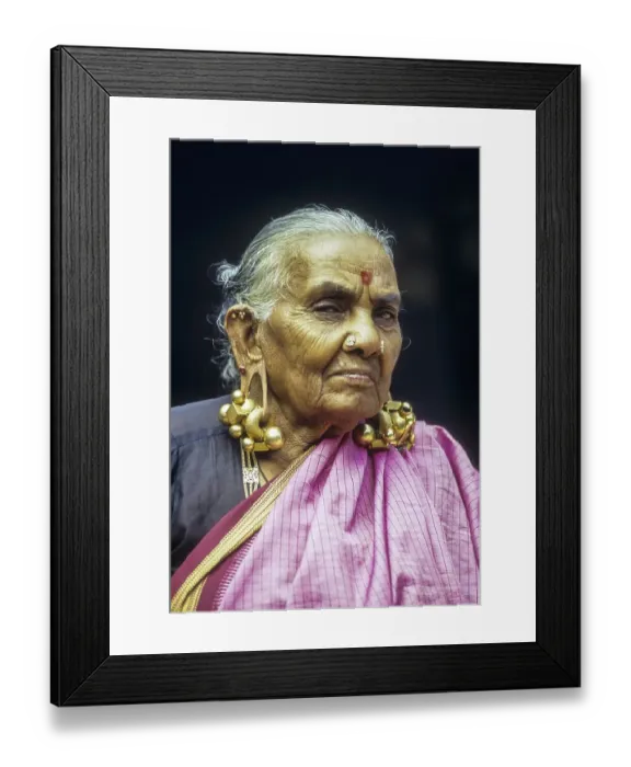 Framed Print : An old women wearing Thandatti massive ear ring to lengthen her ear lobes Framed Print : An old women wearing Thandatti massive ear ring to lengthen her ear lobes