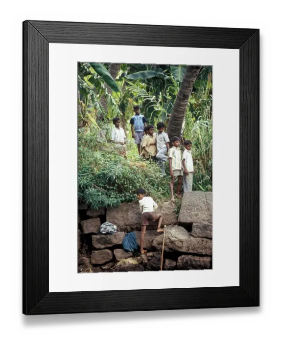 Framed Print : Boys enjoying their holidays standing near a river at Courtalam Kutralam Kuttalam