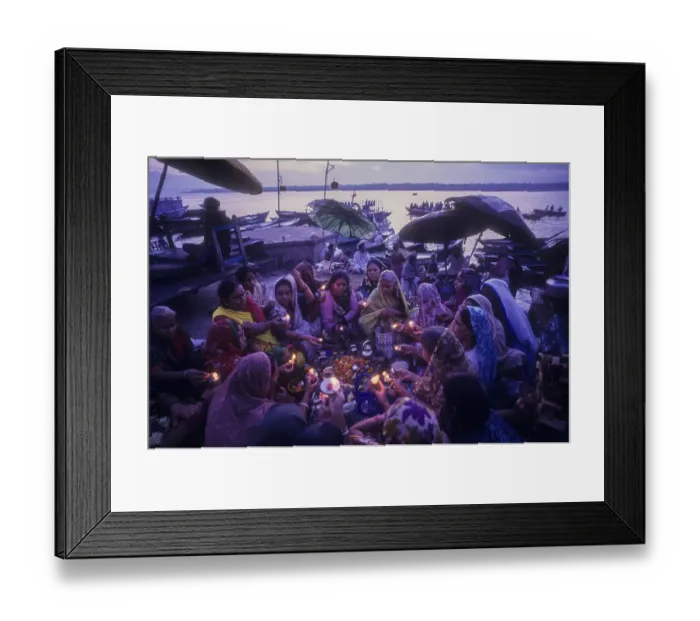 Framed Print : Women with lighted diyas praying to basel plant Tulsi puja on Ganga Ganges ghats of Varanasi Benaras