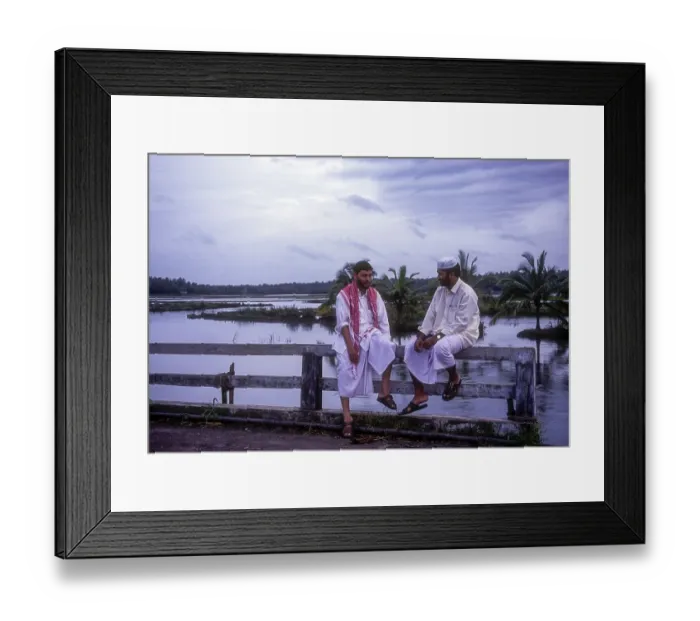 Framed Print : Mappila Muslims sitting on bridge handrail wall in Kodungallur