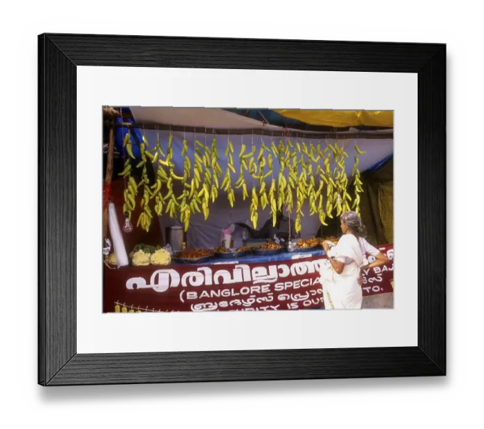 Framed Print : A shop selling chilli fritters Framed Print : A shop selling chilli fritters