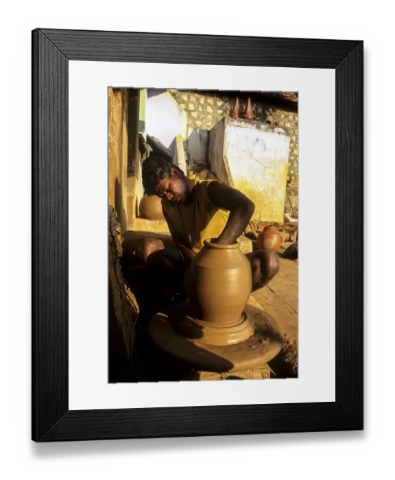Framed Print : A man making Ghatam percussion instrument at Manamadurai Framed Print : A man making Ghatam percussion instrument at Manamadurai