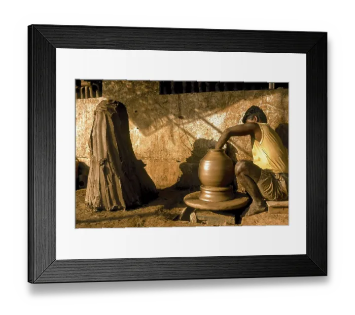 Framed Print : A man making Ghatam percussion instrument at Manamadurai
