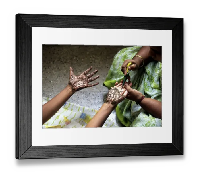 Framed Print : A woman showing mehandi henna applied on a girls hand