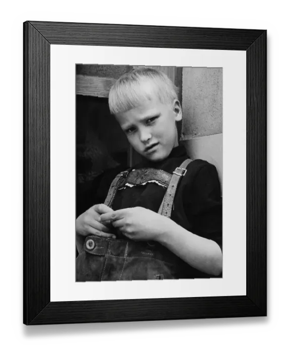 Framed Print : Young boy wearing lederhosen, traditional leather trousers