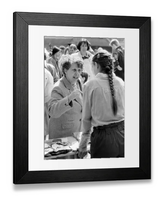 Framed Print : Discussion at a street festival Framed Print : Discussion at a street festival