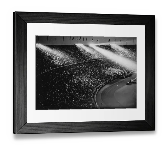 Framed Print : The spotlights chase beams of light over the crowds Framed Print : The spotlights chase beams of light over the crowds