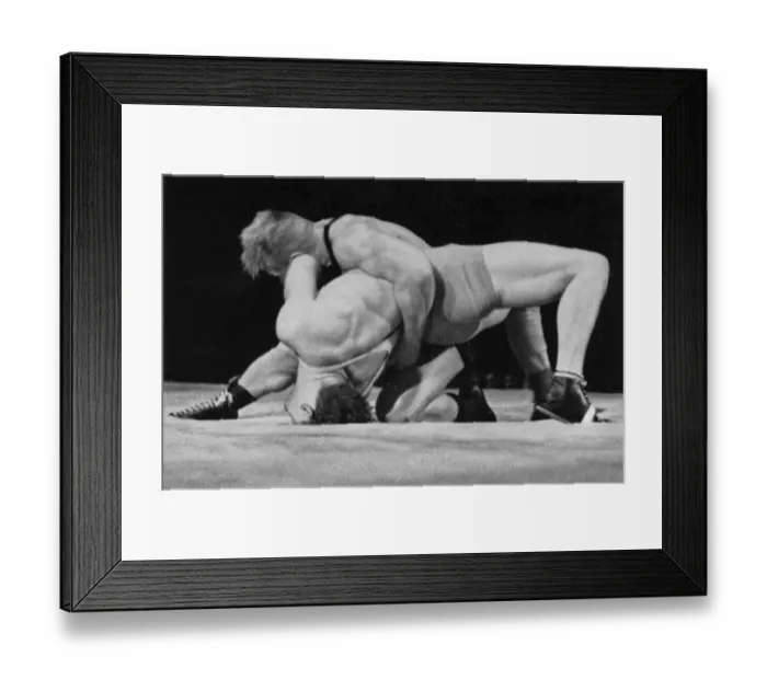 Framed Print : Wrestling, he two-time Olympic champion Palusalu (Estonia) pushes Hornfischer (Germany) into the bridge
