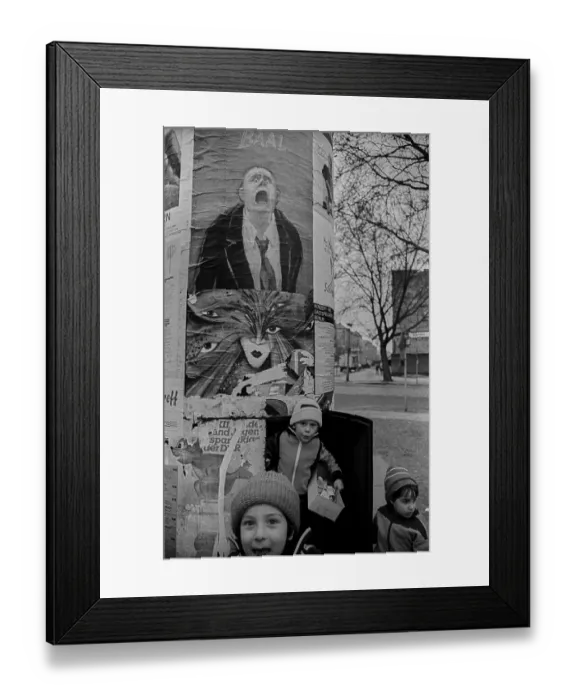 Framed Print : GDR, Berlin, 18. 03. 1989, children in an advertising pillar