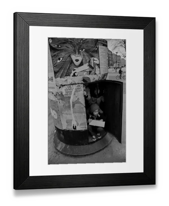 Framed Print : GDR, Berlin, 18. 03. 1989, children in an advertising pillar