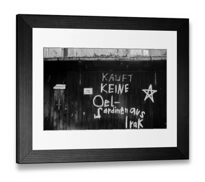 Framed Print : Germany, Berlin, 15.12.1990, Graffiti on a backyard in Kollwitzstrasse: Don't buy oil sardines from Iraq