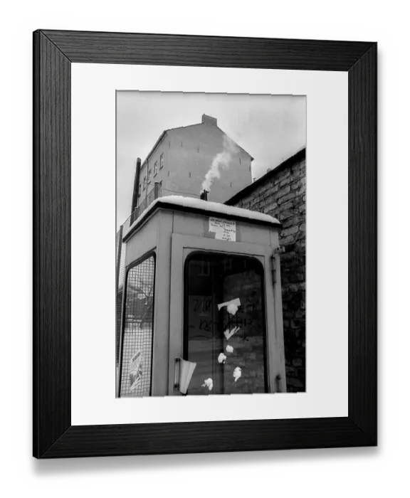 Framed Print : Germany, Berlin, 19.02.1991, smoking telephone box (GDR)