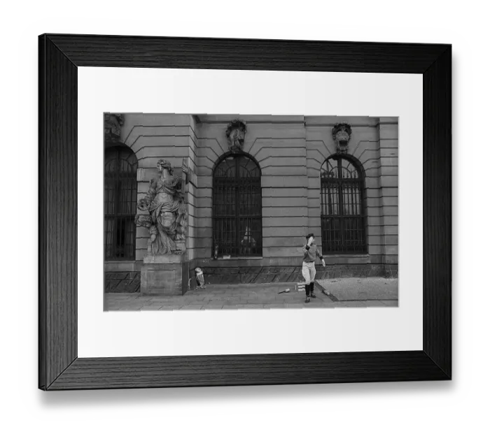 Framed Print : GDR, Berlin, 30 April 1990, Juggler in uniform in front of the German Historical Museum (DHM)