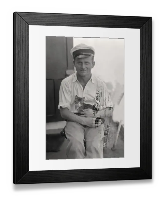Framed Print : Sailor with cat in his arms on board a cargo ship