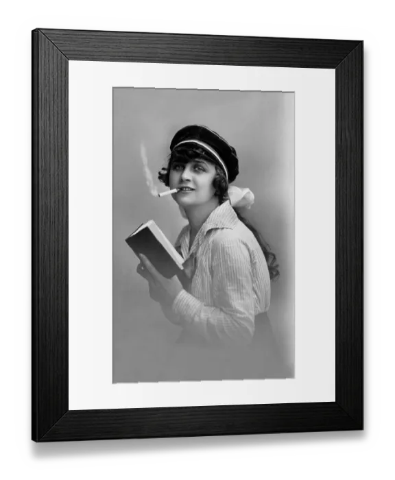 Framed Print : Modern youth, woman reading a book and smoking