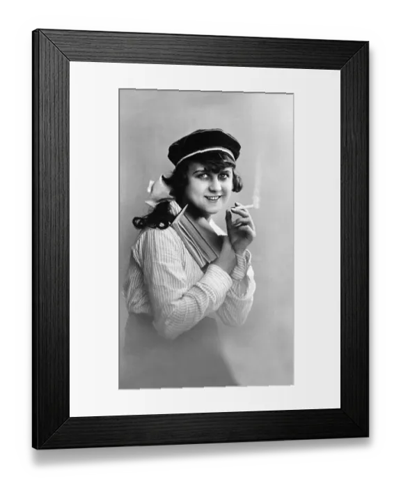 Framed Print : Modern youth, woman reading a book and smoking