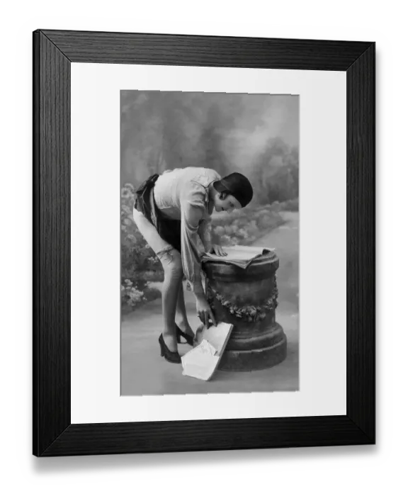 Framed Print : Woman bending to pick up leaves Framed Print : Woman bending to pick up leaves