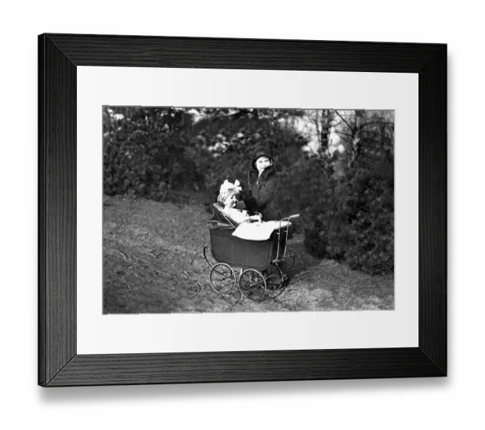 Framed Print : Historic photograph, girl playing with a doll
