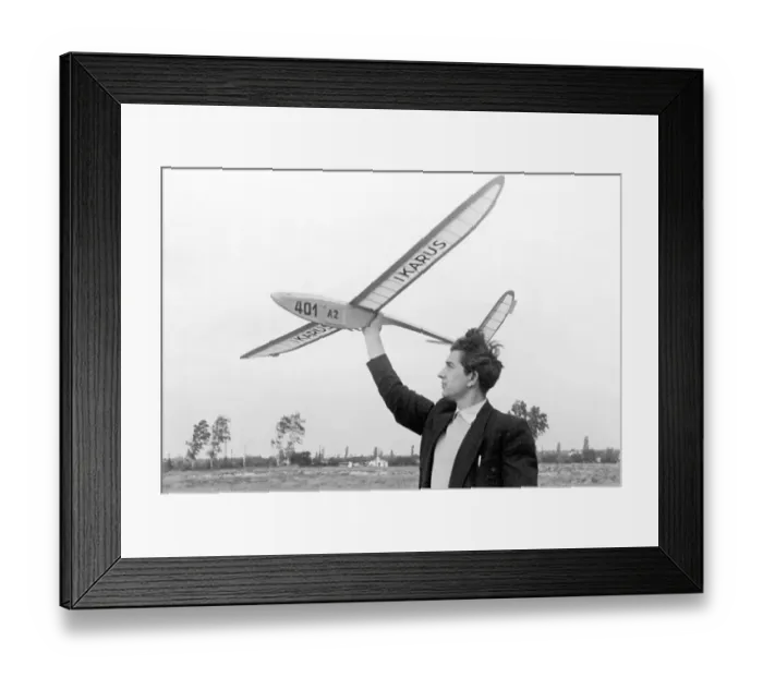 Framed Print : Historic photograph, man holding a model glider plane