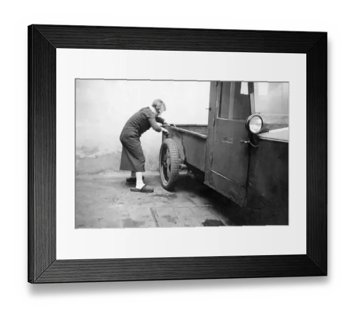 Framed Print : Woman cleaning a car, historical image, ca. 1929