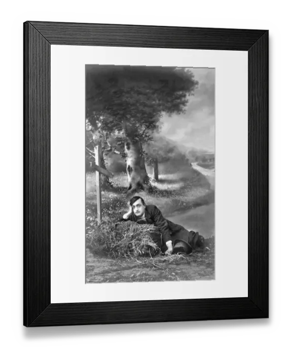 Framed Print : Man seated beside a grave, historical image